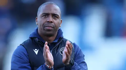 Darren Byfield claps the crowd after a game
