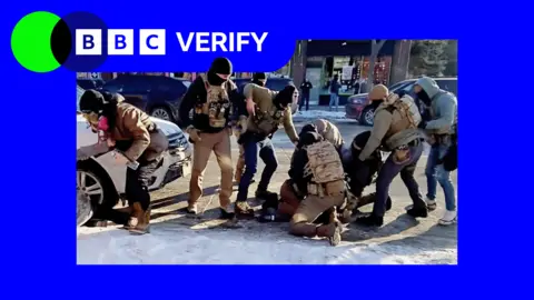 Screengrab from video showing several officers restraining Alex. Has a Verify branded blue border.