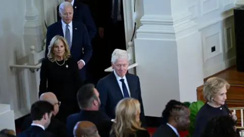 Getty Images President Joe Biden with President Bill Clinton and first ladies Jill Biden and Hilary Clinton