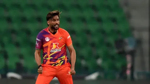 Mohammad Amir celebrates taking a wicket for Rawalpindi in the Pakistan Super League.