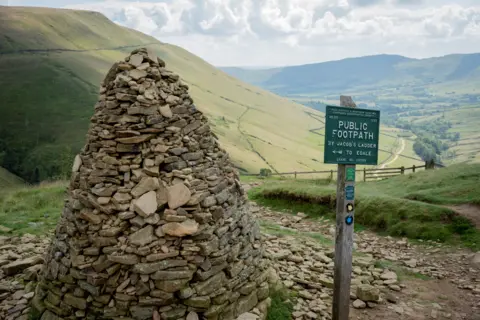 Getty Images The cairn at the top of Jacob's ladder steps en-route to Kinder Scout on the lower stages of the Pennine Way, on 17 July 2024, in Edale, Derbyshire