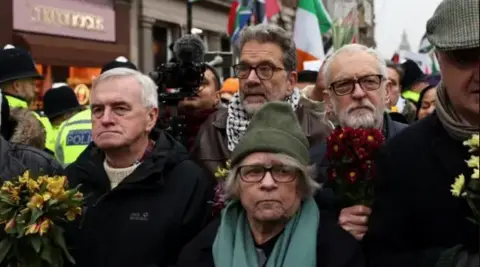 Reuters Five protesters, including John McDonnell and Jeremy Corbyn in a crowd outside