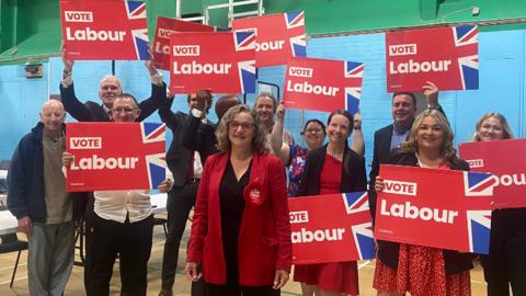 Jodie Gosling surrounded by supporters holding vote Labour placards