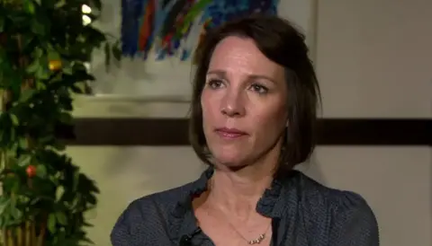 Lorin LaFave, pictured here in 2019. She is wearing a blue shirt and has shoulder length hair.