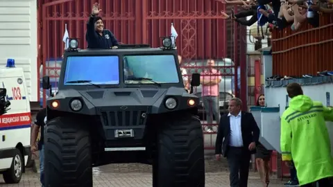 Getty Images Maradona riding an all-terrain vehicle in Belarus