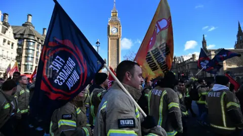 EPA-EFE/REX/Shutterstock Firefighters protest outside parliament in London