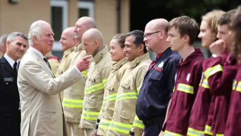 PA Media The Prince of Wales meeting firefighters during a visit to Morecambe Fire Station