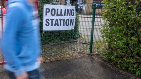 Man walking into a polling station