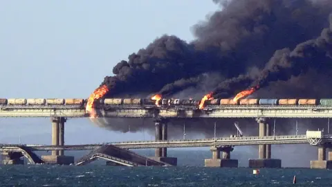 AFP Kerch bridge ablaze with smoke billowing