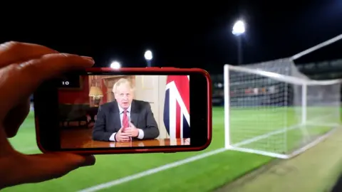 Getty Images Boris Johnson on smartphone screen