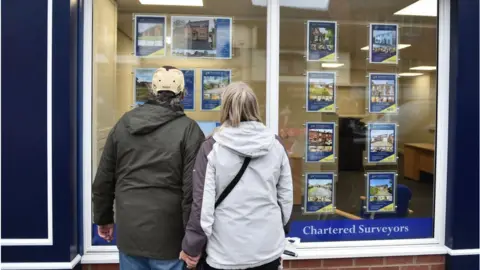 Getty Images Couple look at houses for sale