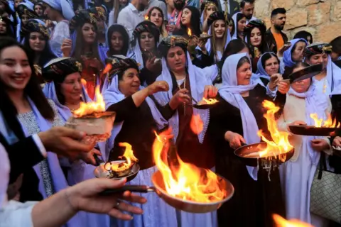 Ari Jalal / Reuters Iraqi Yazidis visit the Lalish Temple