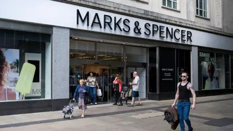 Shoppers and people outside Marks & Spencer in Swansea