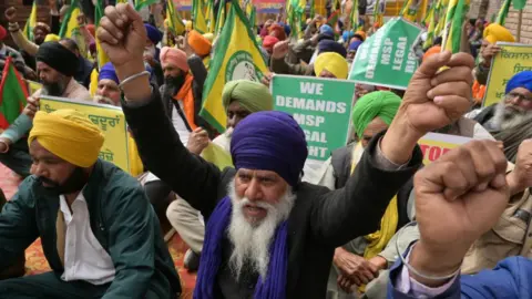 Getty Images Farmers shout slogans during a protest against India's central government to demand minimum crop prices in Amritsar on 5 March 2024.