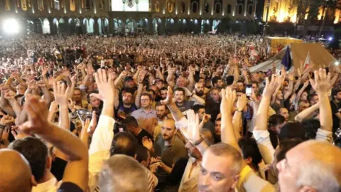 Reuters An anti-government rally outside parliament in Tbilisi, Georgia