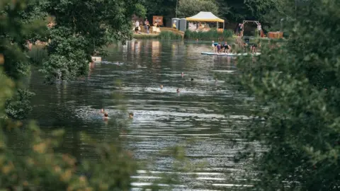 Fanatic  People swimming in a lake at Cornbury Lake