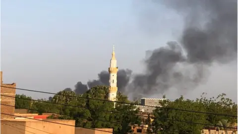 BBC/ Zeinab Mohammed Salih Smoke above buildings