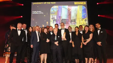 Times Higher Education Staff on the stage as the University scoops the award
