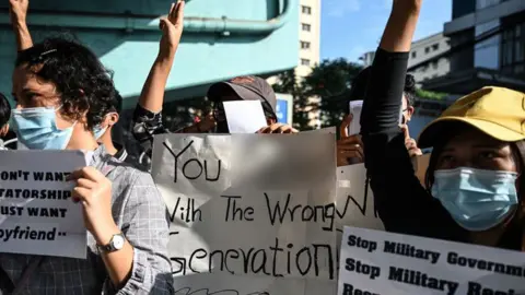 Getty Images "You [expletive] with the wrong generation" read one sign, suggesting that these young protesters won't accept the coup