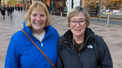 Jackie Watkins with another woman stood next to her