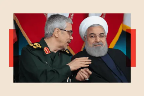 Getty Images A file photo dated 18 April 2019 shows Iranian Chief of Staff Mohammad Bagheri and then-Iranian President Hassan Rouhani attending a military parade in Tehran, Iran.