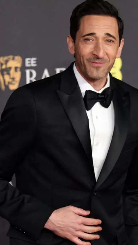 Reuters Adrien Brody in a black tuxedo and bow tie