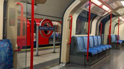 View of an empty Central carriage at Shepherd's Bush Underground Station