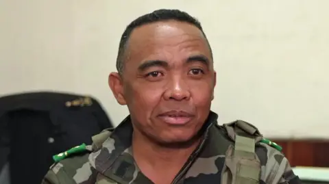 A close-up of Col Michael Randrianirina in a military outfit 