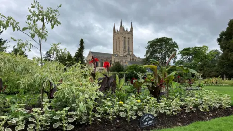 Jon Wright/BBC St Edmundsbury Cathedral in the background with flowers in the Abbey Gardens in the foreground.