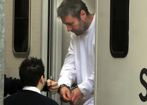 Daily Mail / Solo Syndication File image of John Worboys being led in handcuffs from a prison van