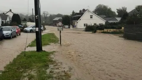 Lowri Mair Price Flood water runs through Talysarn, near Lampeter