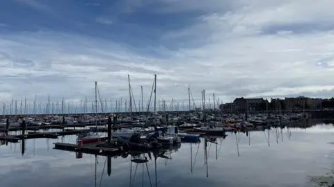 Bangor Marina. Boats in water with blue sky.