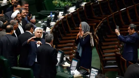 EPA Iranian lawmakers take souvenir picture with EU foreign policy chief Federica Mogherini at the Iranian parliament after president Hassan Rouhani was sworn-in for his second four-year term of presidency, at the parliament in Tehran, Iran