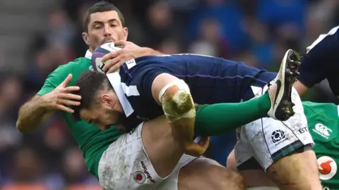 Ireland full-back Rob Kearney is tackled by Scotland centre Alex Dunbar in their 2017 Six Nations match