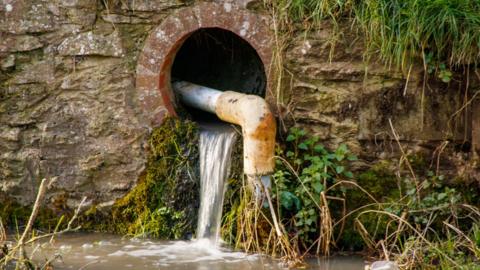 water pipe, going into river