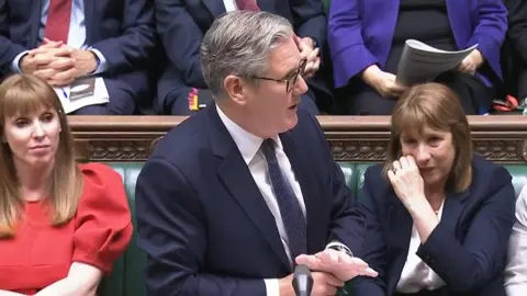 House of Commons/UK Parliament/PA Wire Chancellor Rachel Reeves appears tearful next to Keir Starmer and Angela Rayner