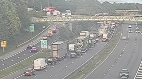National Highways A screengrab of a busy motorway after a crash.