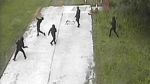 Greater Manchester Police Suspects throwing items