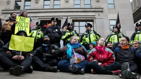 Getty Images Protesters linked arms in the street on Inauguration Day