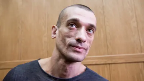 Getty Images Petr Pavlensky attends a hearing at Moscow's Meshchansky district court on 18 May 2016.