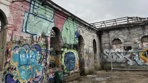 A disused building covered in graffiti