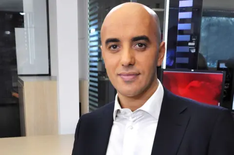 IBO/SIPA/REX/Shutterstock A head and shoulders picture of Redoine Faid in a white shirt and suit
