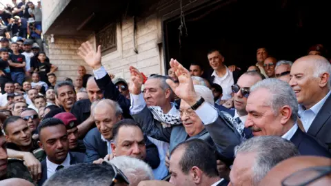 Reuters Palestinian President Mahmoud Abbas waves during a visit to Jenin refugee camp, in the occupied West Bank (12 July 2023)