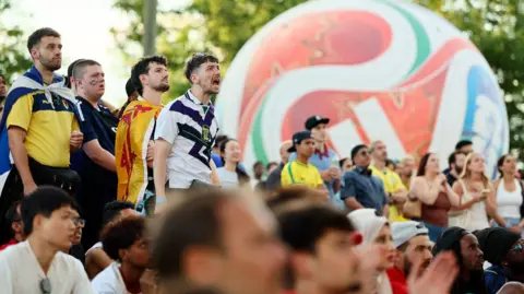 IMAGN IMAGES/Reuters Scotland fans react as they watch the match at the Brooklyn Bridge park watch party 
