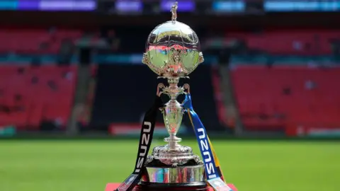 An image of the FA Trophy at Wembley