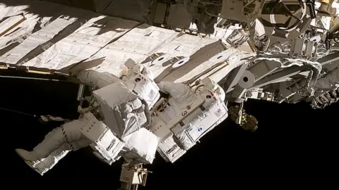 Getty Images Astronauts Daniel C. Burbank (right) and Steven G. MacLean, representing the Canadian Space Agency, translate along the side of one of the station's trusses on the International Space Station on September 13, 2006.