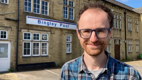 Co-chair of the Friends of Bingley Pool Jeremy Thackray standing outside the building the group wants to save