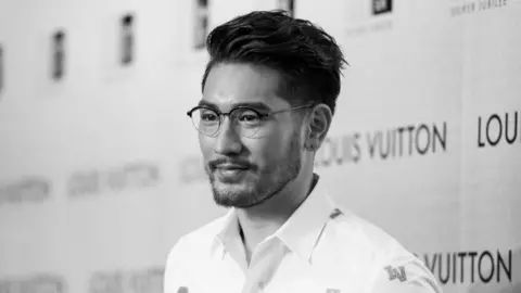 Getty Images Godfrey Gao poses at the red carpet during the opening night of the Time Capsule Exhibition by Louis Vuitton on 21 April 2017
