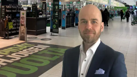 S Group Janne Ahtoniemi, head of risk management at Finnish supermarket company S Group, stands in one of its shops