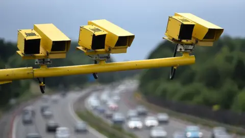 PA Media Average speed cameras on a UK motorway